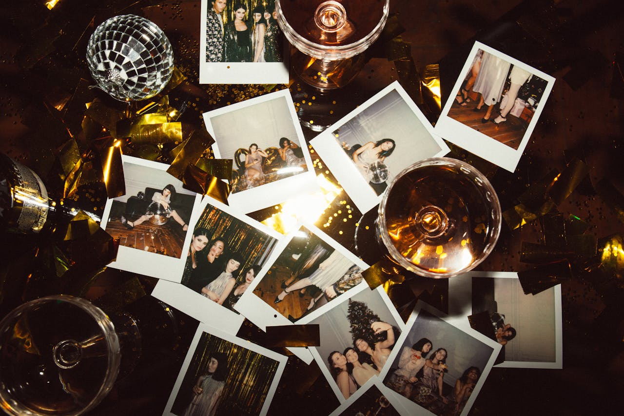 A vibrant party scene featuring Polaroid photos, disco ball, and champagne glasses, perfect for festive occasions.